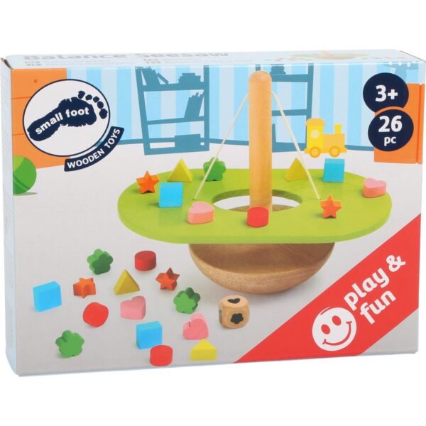 Verpakkingsdoos met de kleurrijke, glad afgewerkte houten speelstukken van de Small Foot evenwichtstoren.